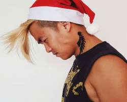 He has a tattoo on his neck.